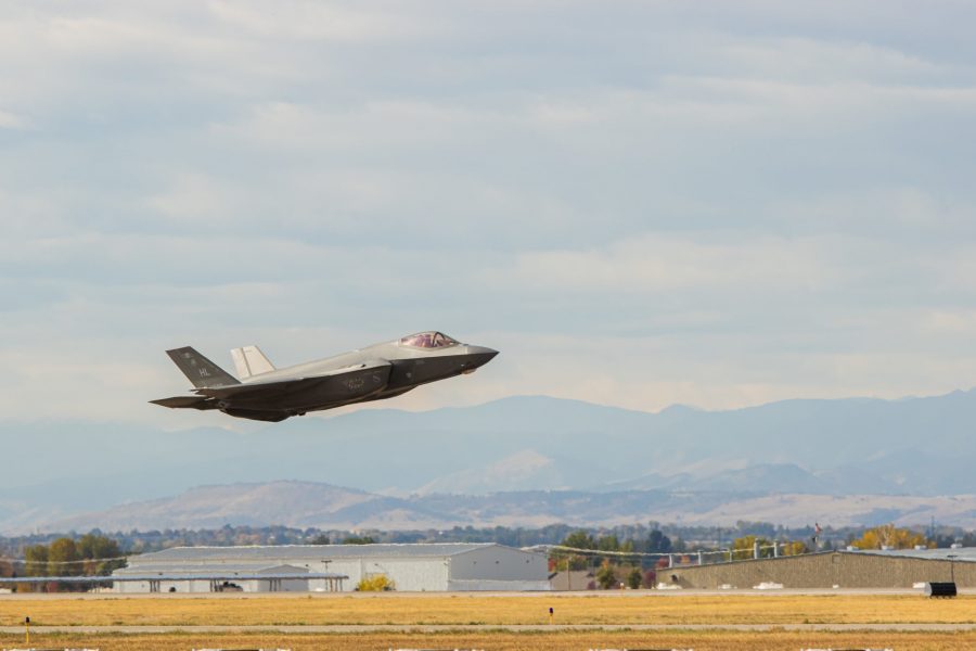 An F-35A makes a low approach pass over