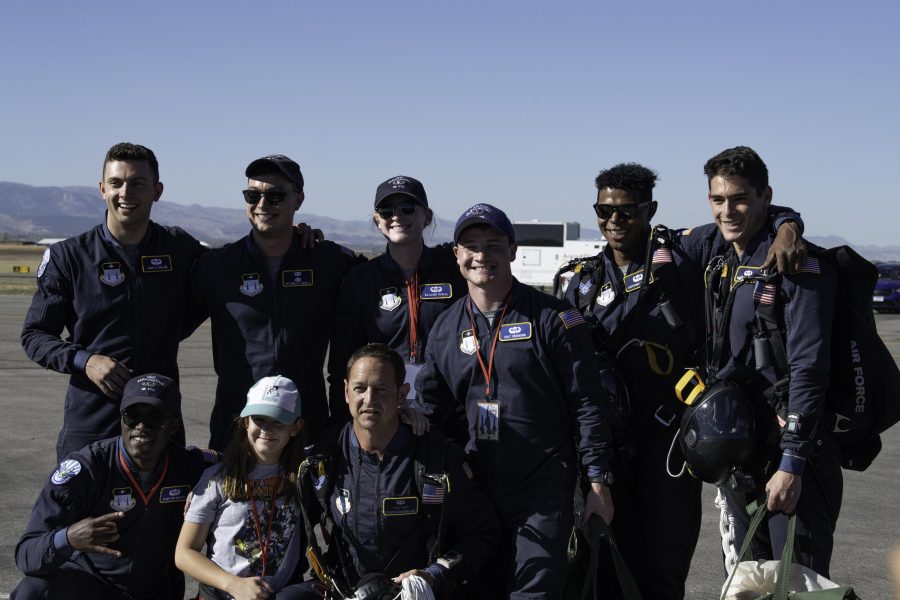 United States Air Force Wings of Blue parachute team pose for an image after jumping into the Great Colorado Air Show held at the Northern Colorado Regional Airport in Loveland Colorado Oct. 17. (Garrett Mogel | The Collegian)