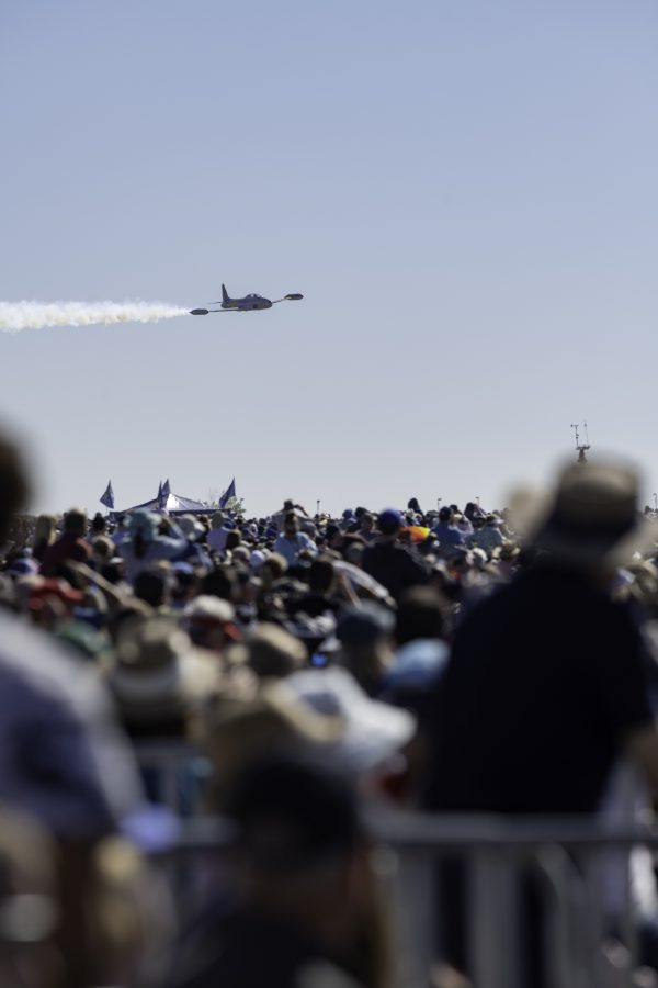 Greg Colyer does a low pass above Great Colorado Air Show ticket holders in a T-33 called the Ace Maker Oct. 17. The airshow featured several performances including the local Rocky Mountain Renegades, Lucas Oil, and the United States Navy Blue Angels. (Garrett Mogel | The Collegian)