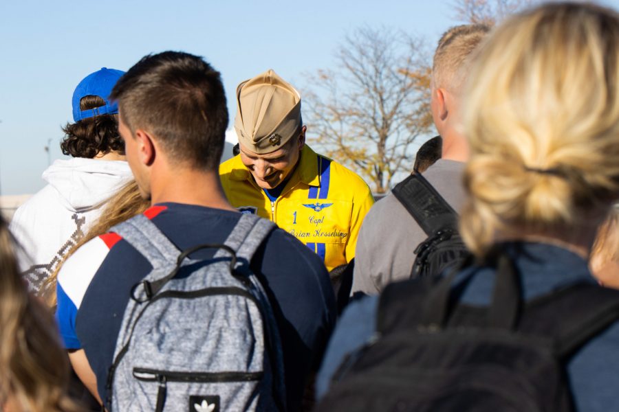 Flight Leader of the U.S. Navy Blue Angels Captain Brian C. Kesselring signs autographs after his performance at the Great Colorado Air Show Oct. 17. Kesselring has over 4,300 flight hours and has been with the Blue Angels since 2019. (The Collegian) 