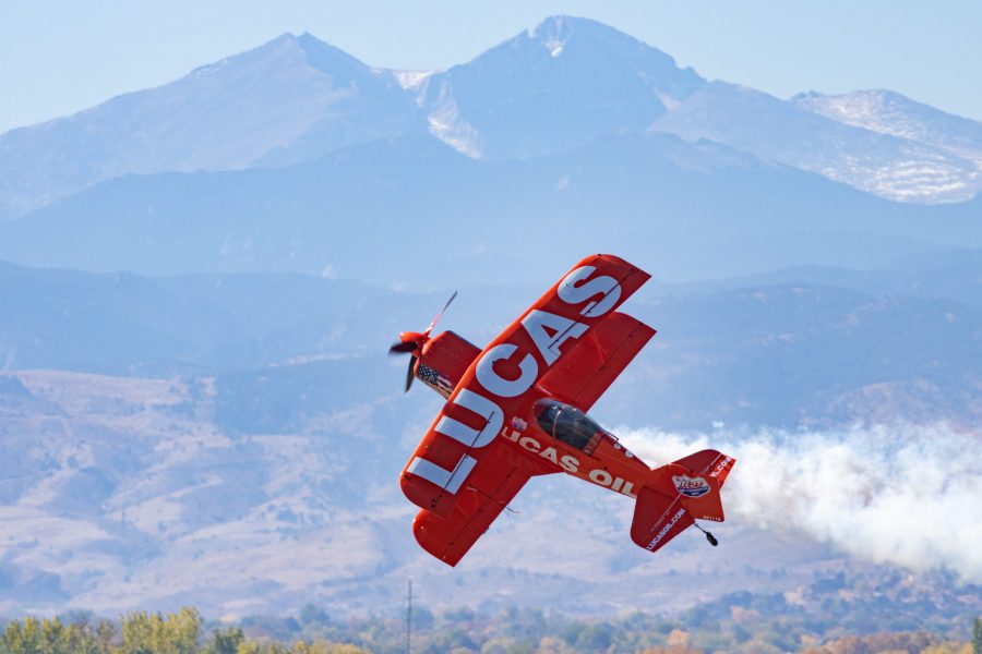 Lucas Oil Air Shows' Michael Wiskus slides his Pitts S-1-11B past the crowd with Longs Peak
