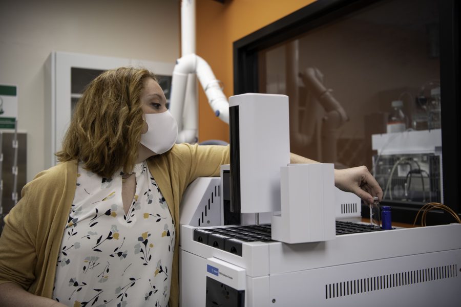 Maddie Roach a Colorado State University student demonstrates how a piece of equipment in the new Cannabinoid Research Center in the CSU Yates Chemistry building works. The lab was a 1.5-million-dollar gift from CSU alumna Leslie Buttorff, CEO of Panacea Life Sciences. Buttorff stated, “What we want to do is find unique cannabinoids that can help people, natural remedies to get rid of big pharma medicine that people have.” Oct. 19. (Garrett Mogel | The Collegian)