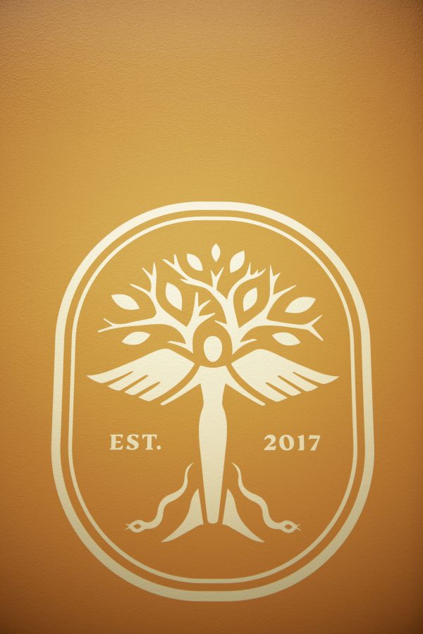 The Panacea Life Sciences logo on the wall of the new Cannabinoid Research Center in the Colorado State University Yates Chemistry building. The lab was a 1.5-million-dollar gift from CSU alumna Leslie Buttorff, CEO of Panacea Life Sciences. Buttorff stated, “What we want to do is find unique cannabinoids that can help people, natural remedies to get rid of big pharma medicine that people have.” Oct. 19. (Garrett Mogel | The Collegian)