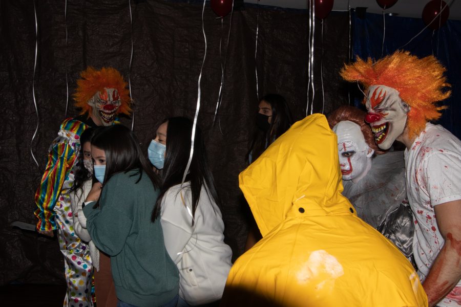 Flash photo of Crystal Pena, Yesenia Rangel, Vanessa Loera and Mariana Arrieta being jump scared at the Theta Chi fraternity haunted house at The Outpost Leasing Center at 530 Lupine Drive, Fort Collins Oct 22. Yesenia afterwards stated, “I’m so out of breath if that says anything, I was holding on so tight.” The Colorado State University fraternity hosted the yearly haunted house to sponsor a fundraiser for the United Service Organizations as their roots were based from military students, 100% of the proceedings went to the USO. (Grayson Reed | The Collegian)