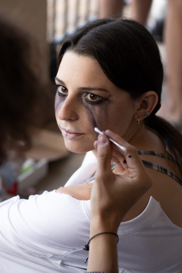Hannah Noel gets her makeup done to be an actor at the Theta Chi fraternity haunted house Oct. 22. (Grayson Reed | The Collegian)
