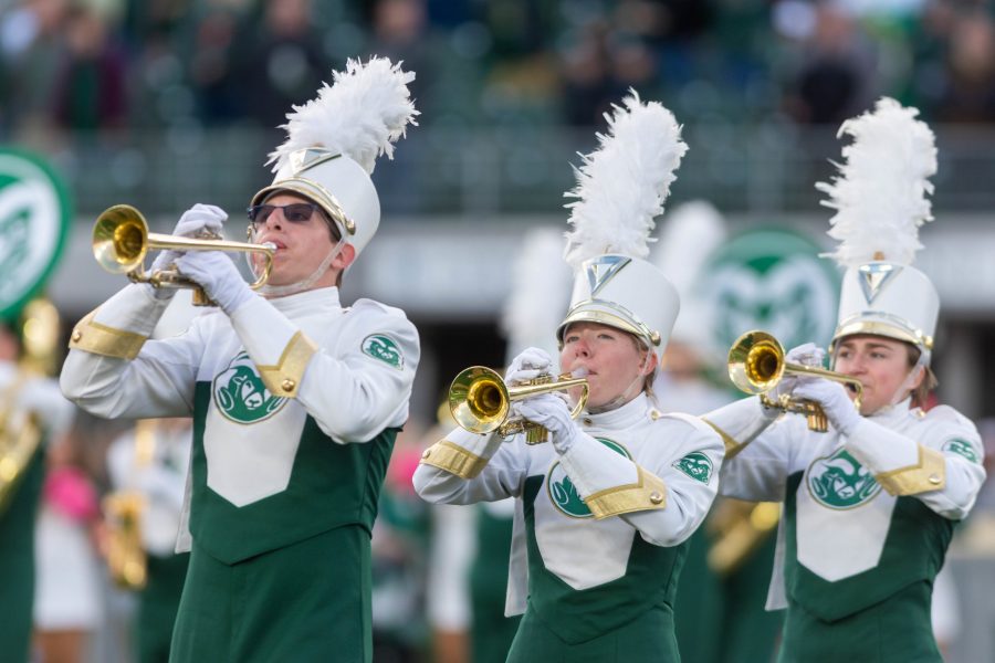 Members of the Colorado State University Marching Band play trumpet during the CSU Fight Song Oct. 30th. The band performed at the opening of the football game against Boise State University in Canvas Stadium. (Connor McHugh | The Collegian)