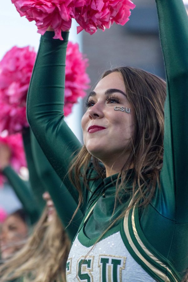 Melanie King, a member of the Colorado State University Golden Poms, dances in a routine in Canvas Stadium during the football game against Boise State University Oct. 30. The Golden Poms used pink pompoms in recognition of Breast Cancer Awareness Month.