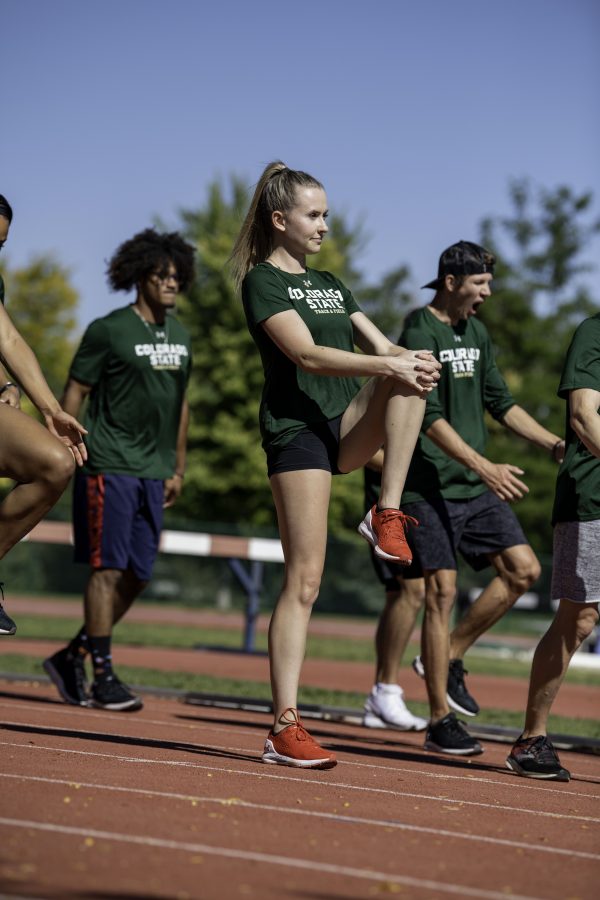 Lauren Gale warms up at practice with the Colorado State University track team on the Jack Christiansen Memorial Track Fort Collins Colorado. Gale after being away for the 2021 Tokyo Olympics stated, “I’ve missed Colorado and missed all my teammates and friend here so I’m excited to be back and run with the team.” Oct. 4. (Garrett Mogel | The Collegian)