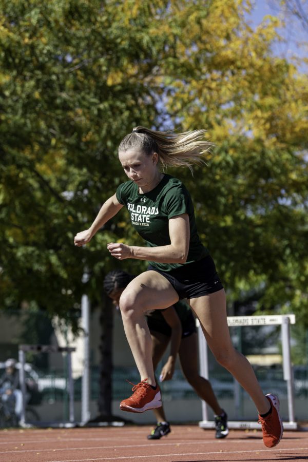 Lauren Gale warms up at practice with the Colorado State University track team on the Jack Christiansen Memorial Track Fort Collins Colorado. Gale after being away for the 2021 Tokyo Olympics stated, “I’ve missed Colorado and missed all my teammates and friend here so I’m excited to be back and run with the team.” Oct. 4. (Garrett Mogel | The Collegian)