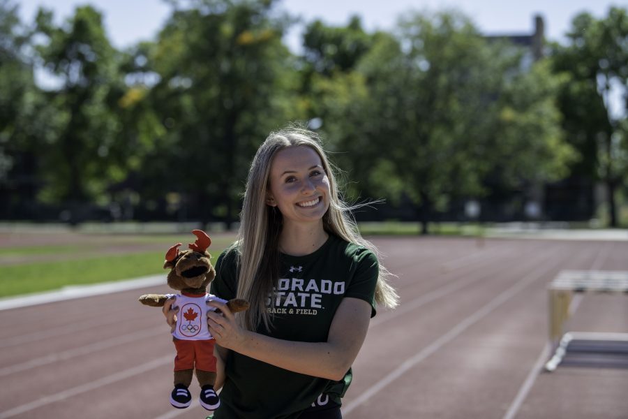 Lauren Gale stands on the Jack Christiansen Memorial Track Fort Collins Colorado holding a stuffed moose named OCHA after the COVID-19 test teams had to take daily while in Japan Oct. 4. (Garrett Mogel | The Collegian) 