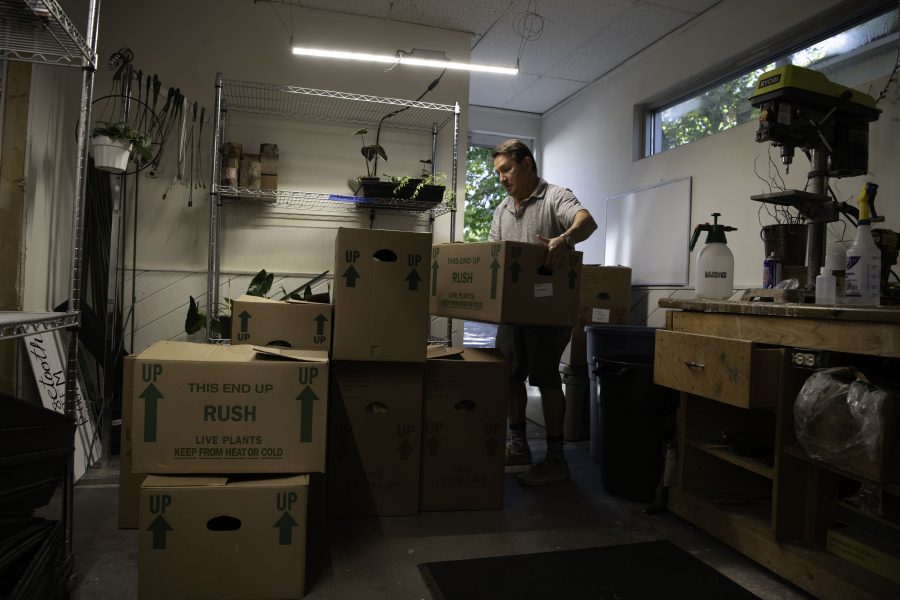 David Cantor co-owner of Horsetooth Stems and Roots House Plant Boutique in Fort Collins Colorado unloads hand chosen plants from a Denver based supplier Oct. 4. (Garrett Mogel | The Collegian)