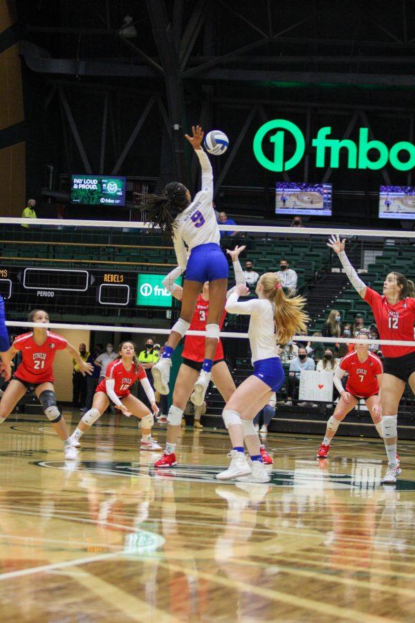 Naeemah Weathers (9), middle blocker, jumps for the ball, Photographer: Avery Coates