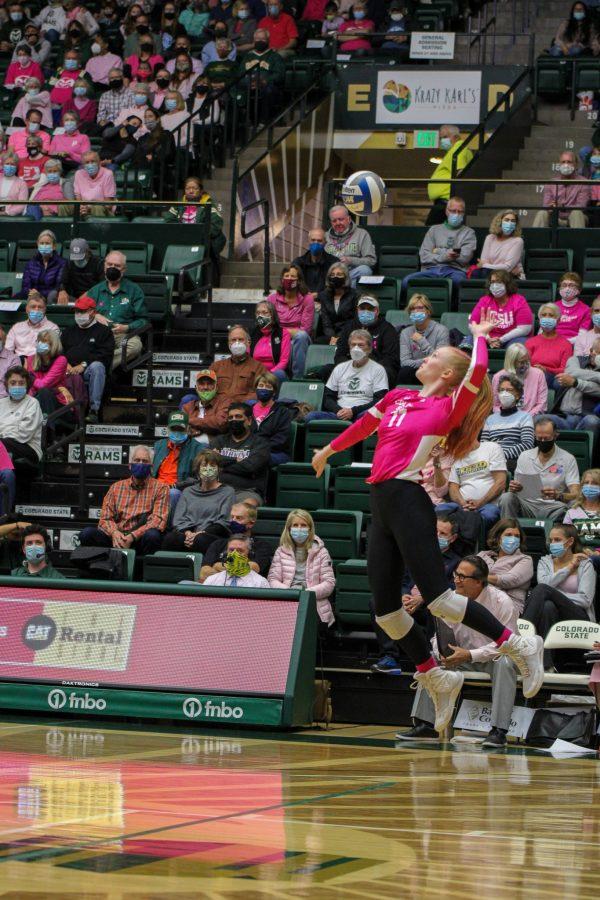 Colorado State University setter Ciera Pritchard (11) serves the ball to the University of New Mexico Lobos Oct. 14. Colorado State swept New Mexico and won 3-0.