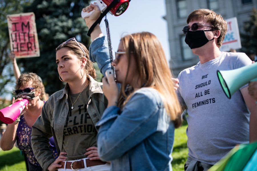 A protester yells at two pro-life advocates who came to the Women’s March with megaphones to counter-protest the event Oct. 2. (Lucy Morantz | The Collegian)