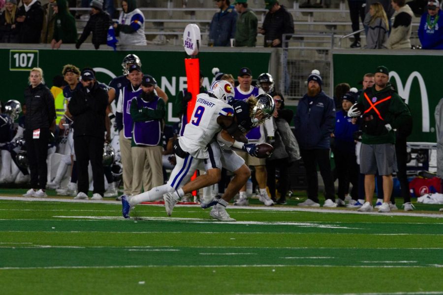 Colorado State defensive back Logan Stewart (9) breaks up a pass to Nevada tight end Cole Turner (19) Nov. 27.
