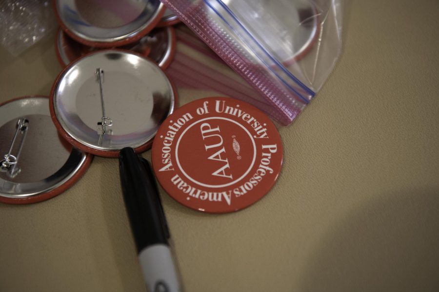 Buttons at the Unionization at Colorado State University panel in the glory student center Oct. 28. (Garrett Mogel | The Collegian)