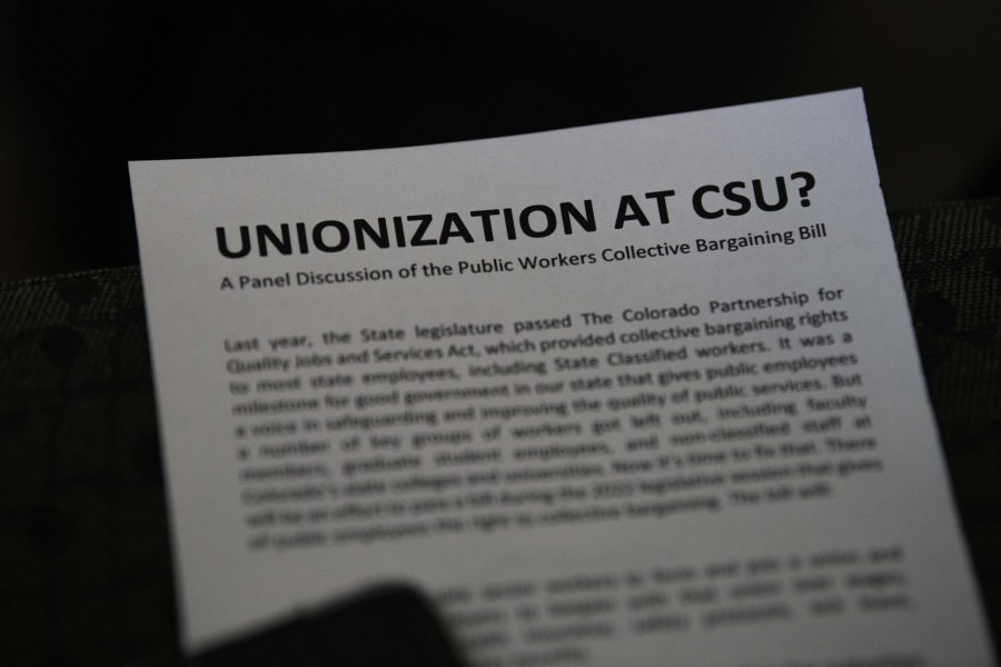 A pamphlet reading “Unionization at CSU” is distributed to audience members of a panel which took place in the Colorado State University Lory Student Center Oct. 28. The panel was a discussion as well as a Question and answer to the public workers collective bargaining bill. (Garrett Mogel | The Collegian)