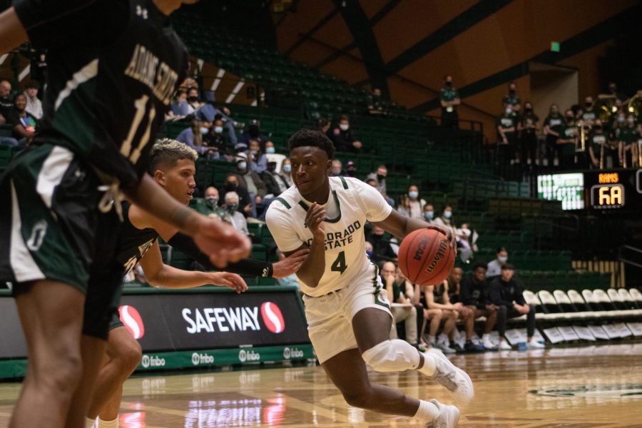 Colorado State guard Isaiah Stevens attempts to dribble past the defense of Adams State in an exhibition match on Oct. 31 at the Moby Arena. The game was won by Colorado State 92-55. (Mykyta Prykhodko | The Collegian)