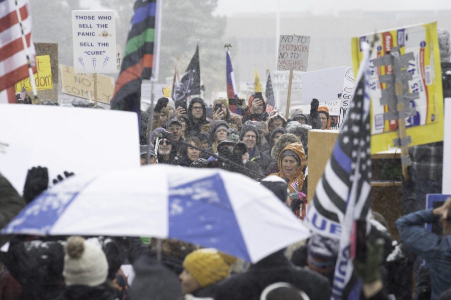 A group of rally-goers gather outside the Fort Collins Colorado Public Health Building Nov. 1. Individuals voiced concerns about varying topics including personal freedoms, vaccine mandates, and health policies. (Garrett Mogel | The Collegian)