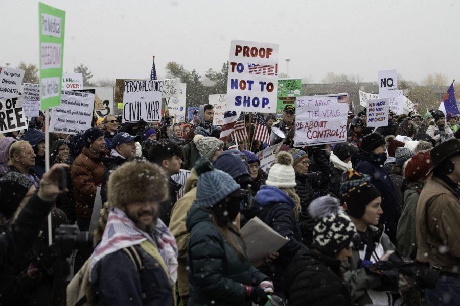 A group of rally-goers gather outside the Fort Collins Colorado Public Health Building Nov. 1. Individuals voiced concerns about varying topics including personal freedoms, vaccine mandates, and health policies. (Garrett Mogel | The Collegian)