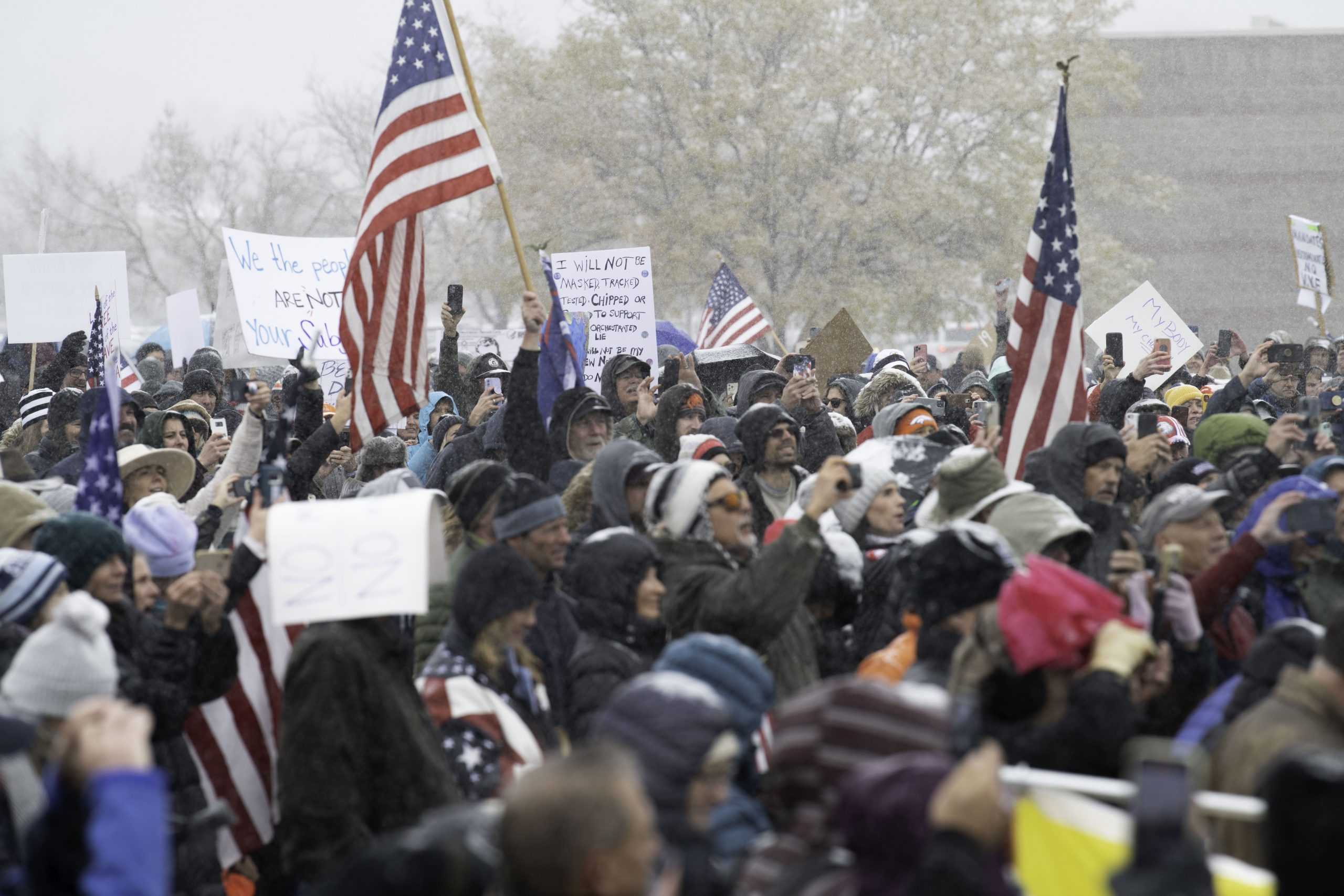 A group of rally-goers gather outside the Fort Collins Colorado Public Health Building Nov. 1. Individuals voiced concerns about varying topics including personal freedoms, vaccine mandates, and health policies. (Garrett Mogel | The Collegian)