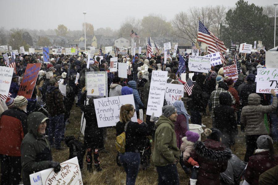 A group of rally-goers gather outside the Fort Collins Colorado Public Health Building Nov. 1. Individuals voiced concerns about varying topics including personal freedoms, vaccine mandates, and health policies. (Garrett Mogel | The Collegian)