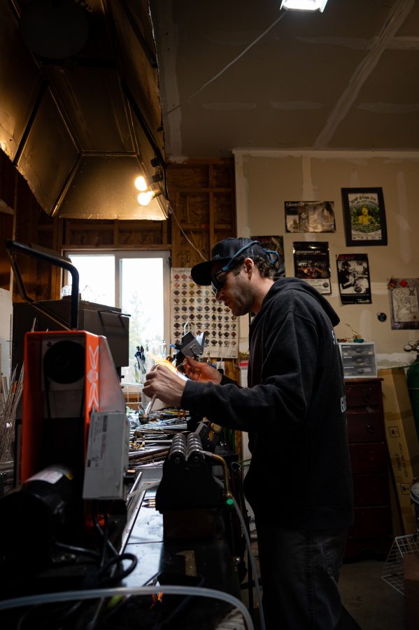 Bryan Ratcliffe works in his home studio on new drinking glassware