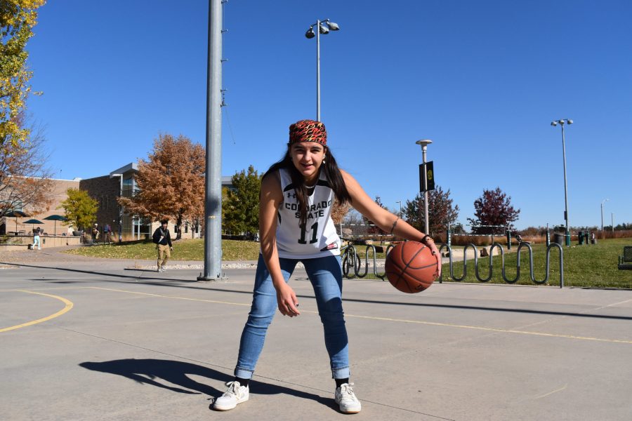 Laramie Woods, President of the Colorado State University Woman’s Club Basketball Team, dribbles a basketball on the court outside of the Student Recreation Center Nov. 5. (Michael Giles | The Collegian).