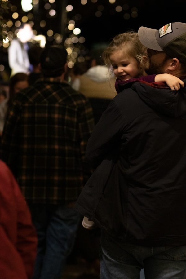 Bystanders watching the Atom Collective live jazz band at the Fort Collins, Old Town Square lighting ceremony Nov 5. (Grayson Reed | The Collegian)