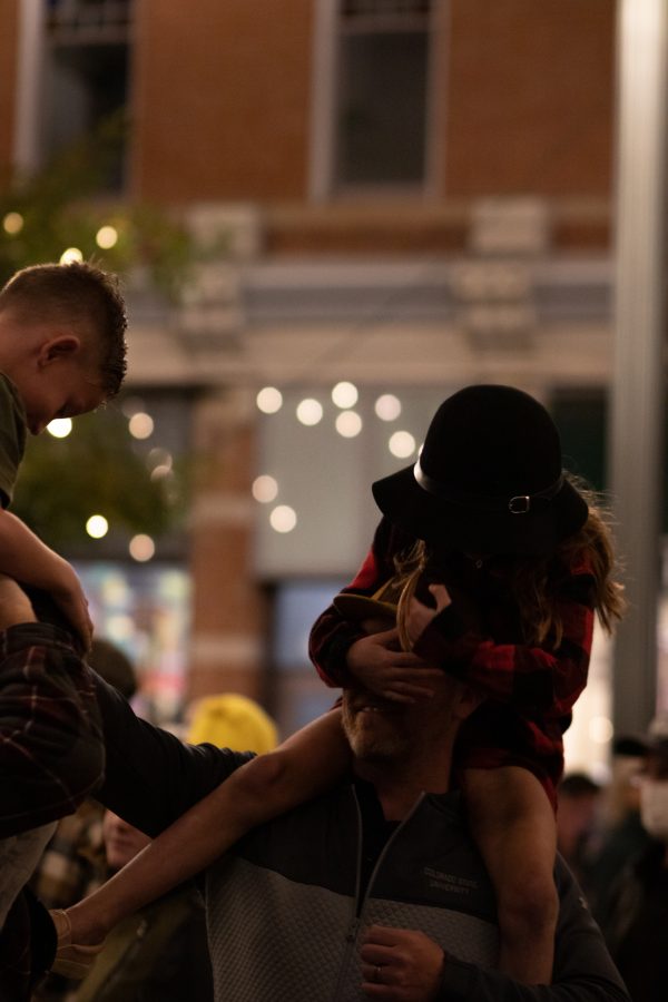 Bystanders enjoying the light show at the Fort Collins, Old Town Square lighting ceremony Nov 5. The ceremony hosted the live jazz band Atom Collective. (Grayson Reed | The Collegian)