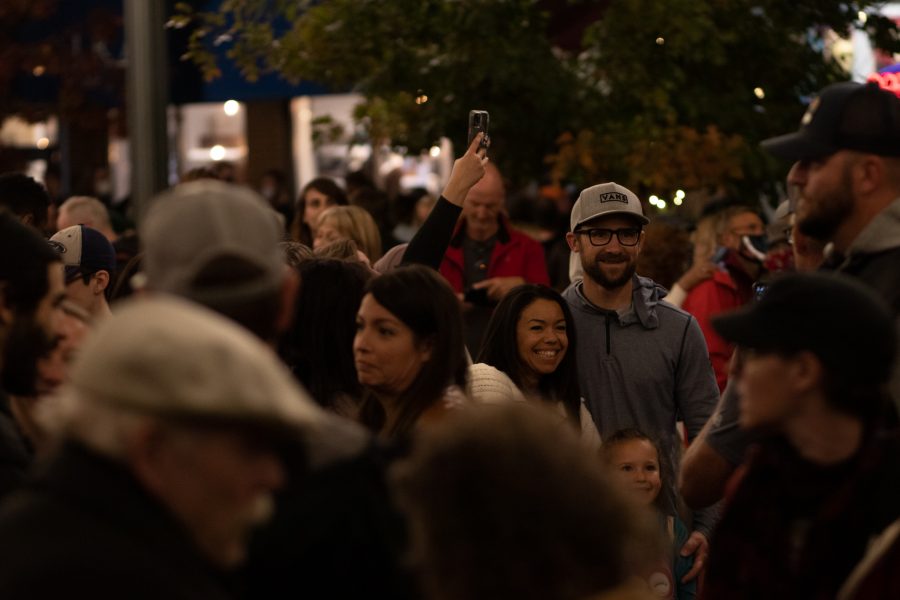 Bystanders enjoying the light show at the Fort Collins, Old Town Square lighting ceremony Nov 5. The ceremony hosted the live jazz band Atom Collective. (Grayson Reed | The Collegian)