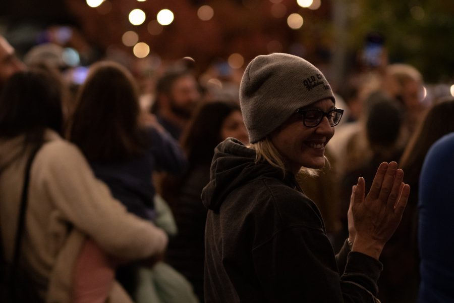 Bystanders enjoying the light show at the Fort Collins, Old Town Square lighting ceremony Nov 5. The ceremony hosted the live jazz band Atom Collective. (Grayson Reed | The Collegian)