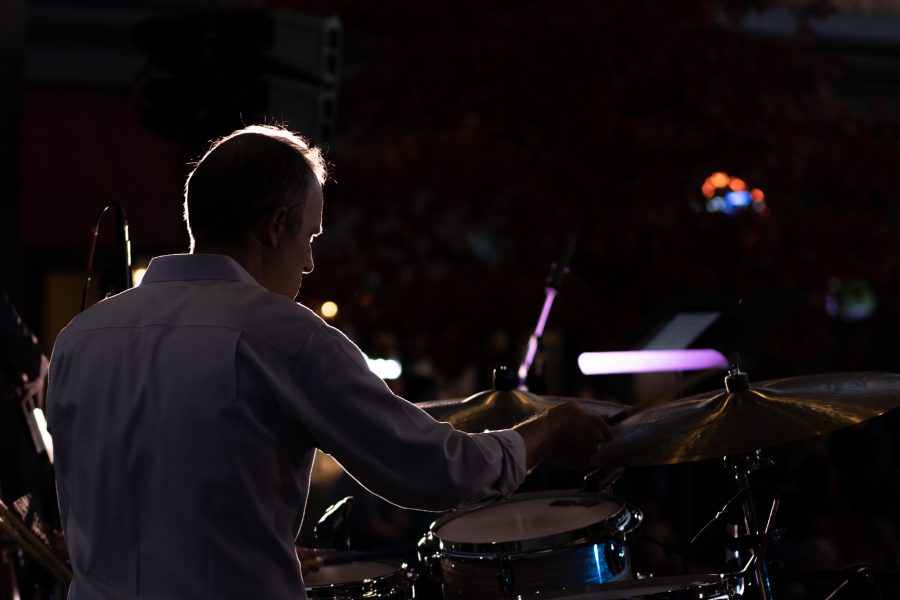 Tobin Munsat plays drums for the live jazz band Atom Collective at the Fort Collins, Old Town Square lighting ceremony Nov 5. (Grayson Reed | The Collegian)