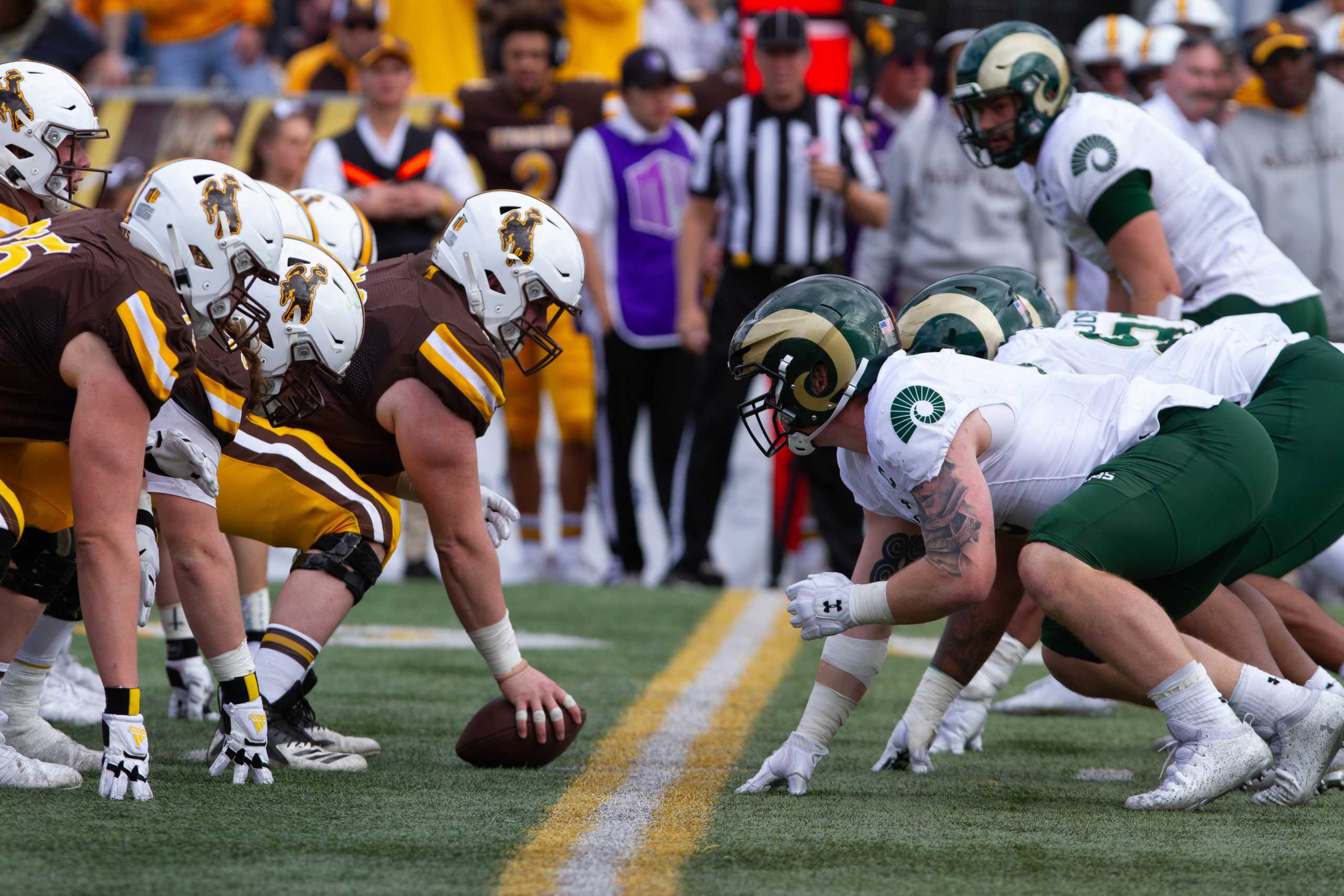 The Offensive and defensive lines of Wyoming and Colorado State respectively line up for a play Nov. 6.