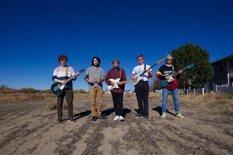 Violet Visionaries band members pose for a photo during practice Nov. 7. They have two upcoming shows and an EP coming out early next year. (Milo Gladstein | The Collegian)