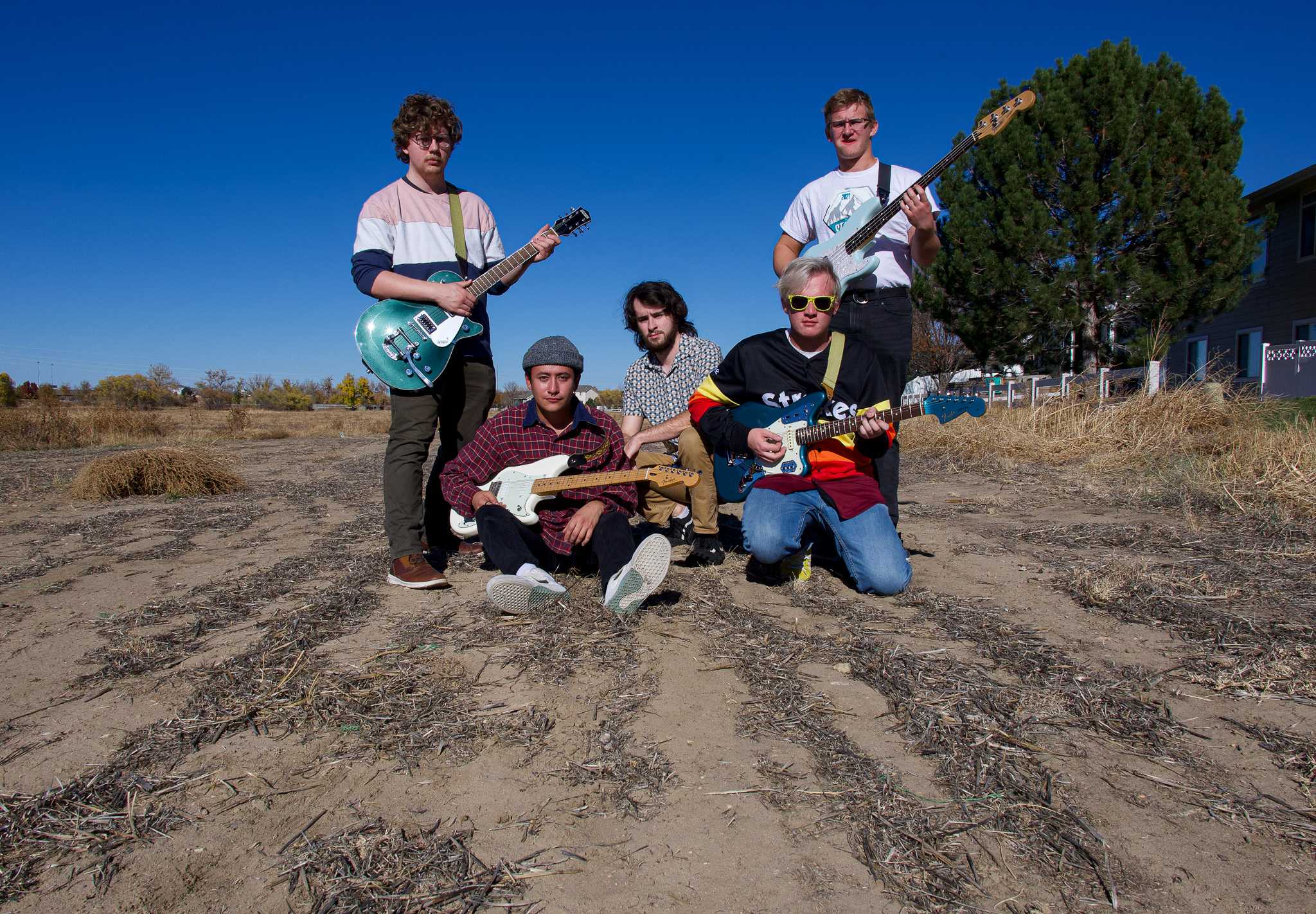 Violet Visionaries band members pose for a photo during practice