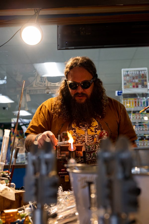 Skye Norton works on a new project at Kind Creations Nov. 9. Norton stated, "I really like making no pipe things, marbles are really fun. I also really like making goblets." (Milo Gladstein | The Collegian)