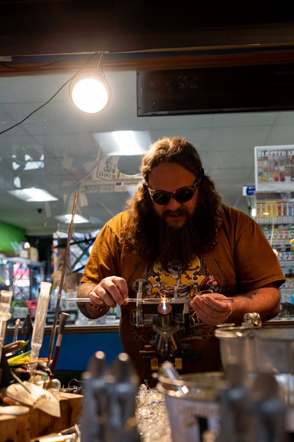 Sky Norton starts on the wig wag technique for a new project in Kind Creations Nov. 9. Norton has worked at this shop for three and a half years. (Milo Gladstein | The Collegian)