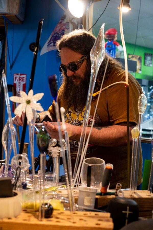 Skye Norton works in Kind Creations amid other works in progress Nov. 9. The most expensive piece Norton has sold cost $2500. (Milo Gladstein | The Collegian)