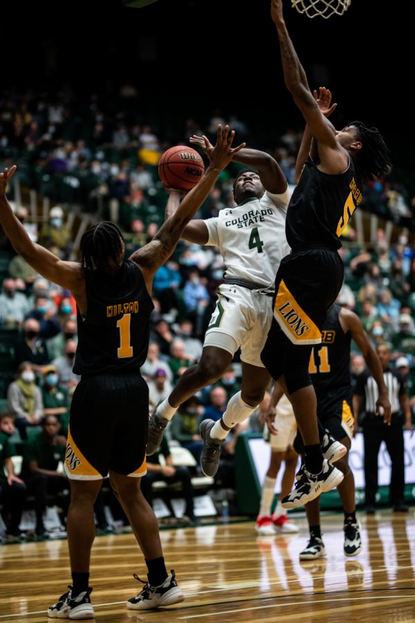 Junior Isaiah Stevens (4) goes up for a layup in the second half Nov. 12. Stevens leads the team in minutes played per game this season. (Lucy Morantz | The Collegian)