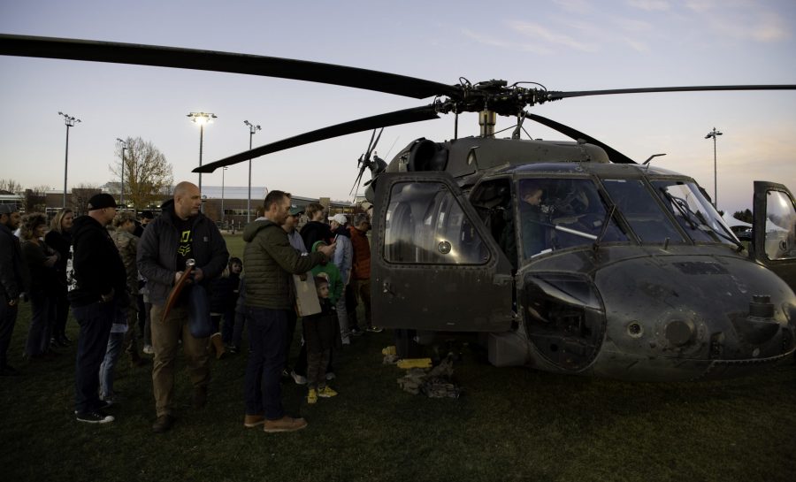 A UH-60L Black Hawk parks on the Colorado State University Intermural Fields as community members gather for a chance to sit in the helicopter Nov. 13. The helicopter was requisitioned by the CSU Army ROTC to make an appearance for military appreciation day as well as CSUs football game against Air Force which resulted in a win for Air Force (35-21). (Garrett Mogel | The Collegian)