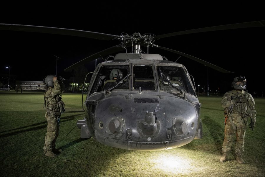 Specialist Nicholas Day, Chief Warrant Officer 2 Nathan Bosso, Chief Warrant Officer 3 Hai ha Vu and Specialist Brian Torres prepare a UH-60L Black Hawk from the 4th Combat Aviation Brigade for take-off from the Colorado State University Intermural Fields Nov. 13. Pilot and CW2 Bosso stated, “Nobody marshaled us in, I came out here and did a ground recon, so I knew exactly where I was going to land.” The helicopter was requisitioned by the CSU Army ROTC to make an appearance for military appreciation day as well as CSUs football game against Air Force which resulted in a win for Air Force (35-21). (Garrett Mogel | The Collegian)