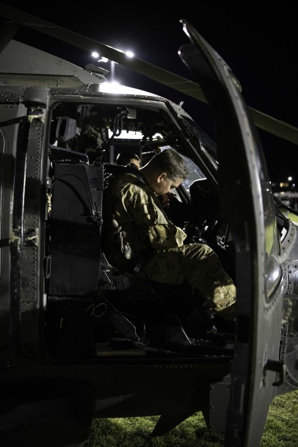 Pilot Chief Warrant Officer 2 Nathan Bosso of the 4th Combat Aviation Brigade prepares a UH-60L Black Hawk for take-off from the Colorado State University Intermural Fields Nov. 13. CW2 Bosso stated, “Nobody marshaled us in, I came out here and did a ground recon, so I knew exactly where I was going to land.” The helicopter was requisitioned by the CSU Army ROTC to make an appearance for military appreciation day as well as CSUs football game against Air Force which resulted in a win for Air Force (35-21). (Garrett Mogel | The Collegian)