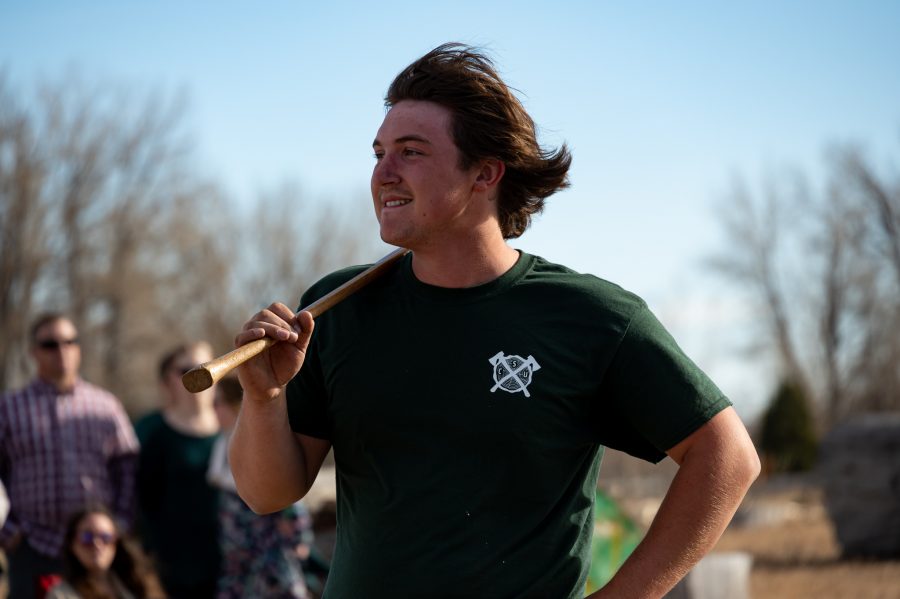 Chris Graham, Vice President of the CSU Logging Team holds an ax after finishing his last event Nov. 14. Graham’s favorite event is, “The obstacle poll, we have slanted polls that are at a 30 degree angle and 5 to 6 feet off the ground. The goal is to start with a chainsaw at the base of the poll, run up to the top, cut a nice clean cookie, come back down cut all your lines and make a good clean time.” (Milo Gladstein | The Collegian)