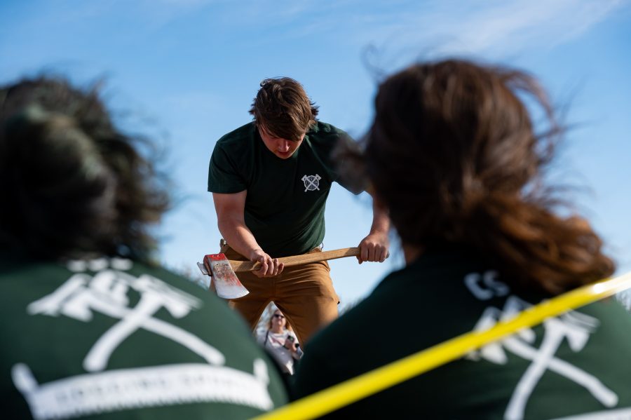 Chris Graham Vice President of the CSU Logging Team swings the ax during the underhand chop event Nov. 14. Graham’s least favorite event is “the choker course. The choker refers to a 70 pound steel cable that’s used for hauling logs, basically you are running through an obstacle course. It’s just a lung killer.” (Milo Gladstein | The Collegian)