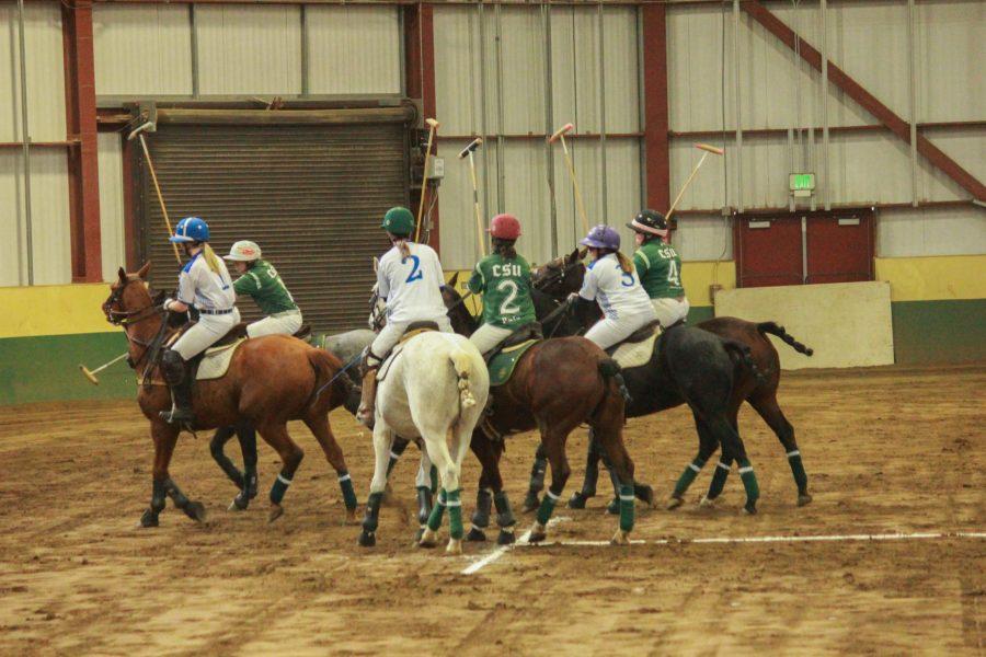 All players fight for the ball after it was thrown in the center to start the chukker.