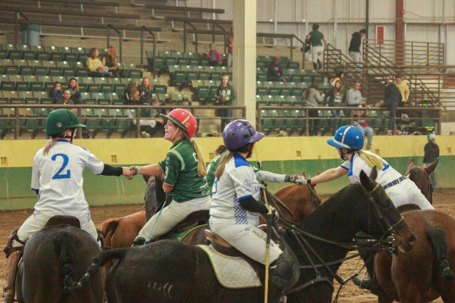 Colorado State and University of Kentucky players shake hands and show good sportsmanship at the end of their match