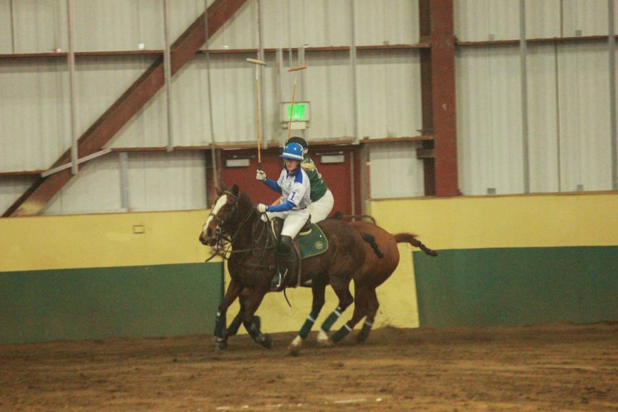 Player one gallops ahead towards the ball.
