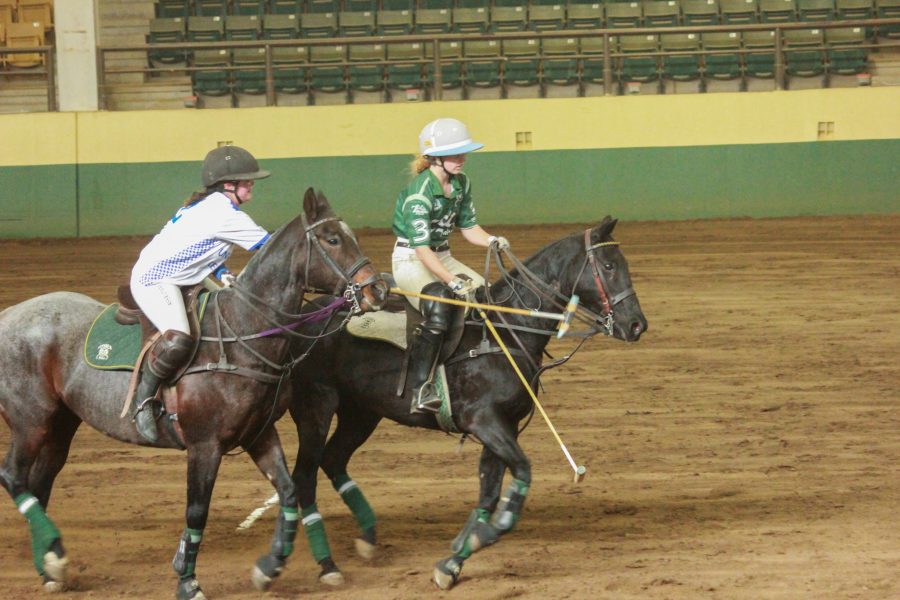 The opposing team attempts to hook player three’s mallet