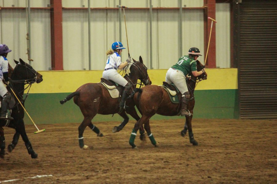Number four prepares to hit the ball backwards toward the home goal.